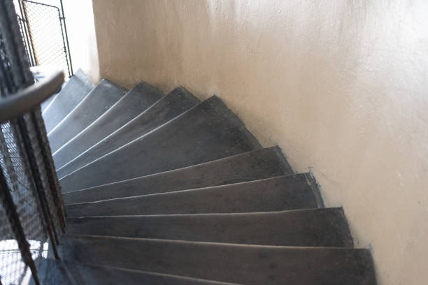 istock Span of an old spiral staircase with wooden steps 1173807753
