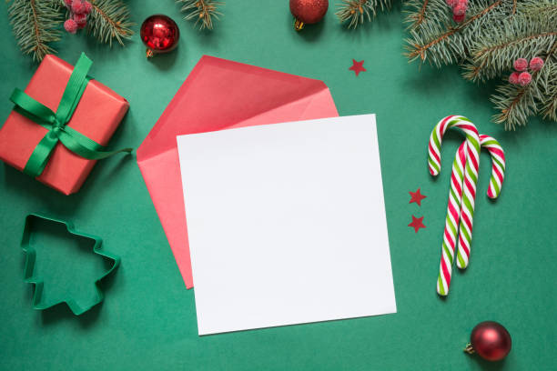 istock Christmas empty blank letter to Santa or invitation on green. Top view. 1173810863