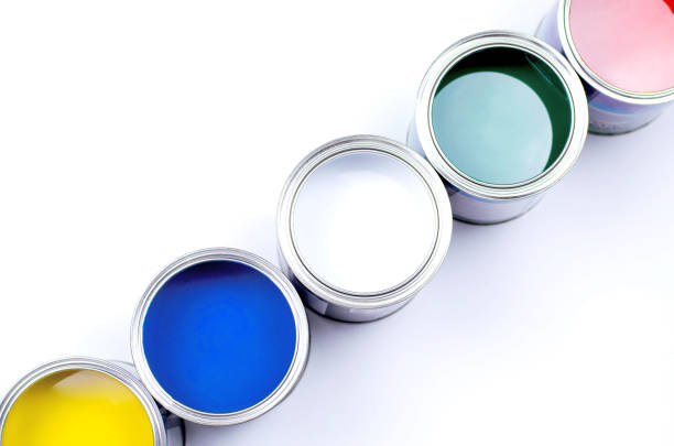 istock Five cans of multicolored paint on a white background. 1173811408