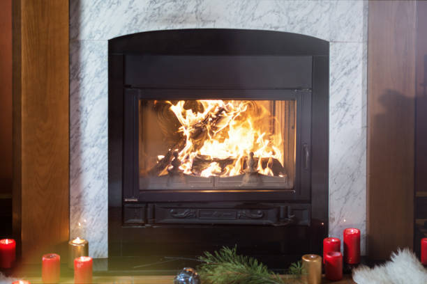 istock Christmas fireplace with red candles 1173815187