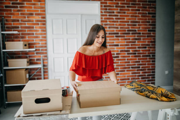 istock Young woman fulfilling online order 1173817562