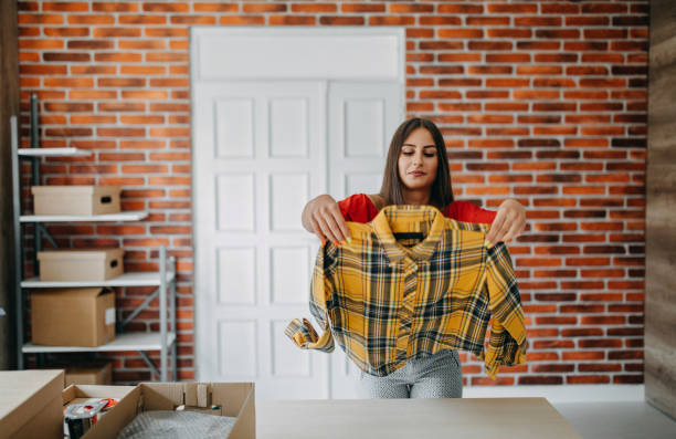 istock Young woman fulfilling online order 1173817844
