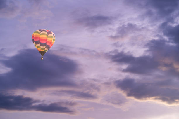 istock Colorful hot air balloon with dramatic sky at sunset 1173818496
