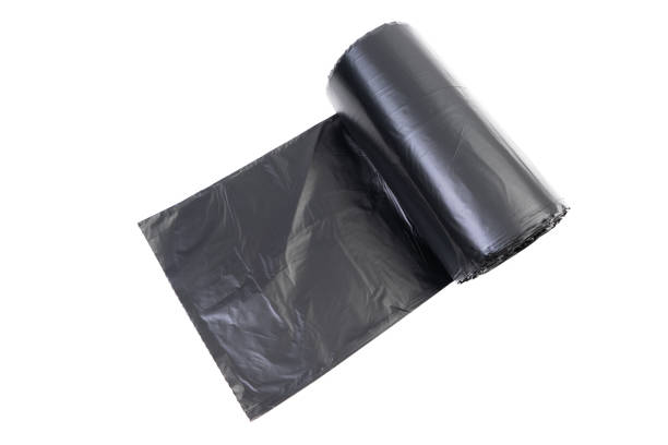 istock Roll of black trash bag on white background 1173818546