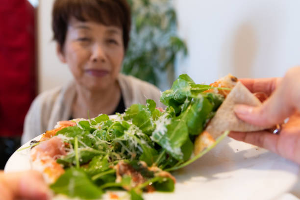 Japanese people eating pizza