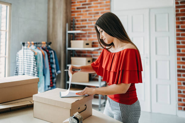 istock Young woman fulfilling online order 1173819911