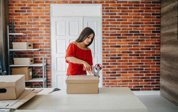 istock Young woman fulfilling online order 1173819975