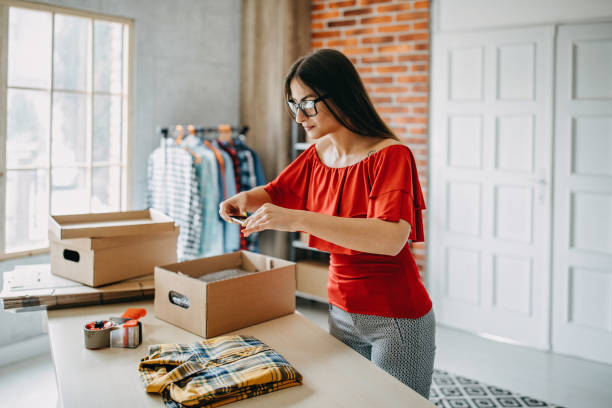 istock Young woman fulfilling online order 1173820507