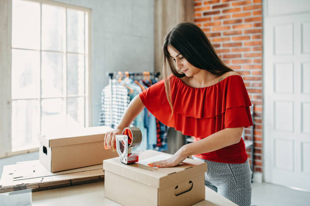 istock Young woman fulfilling online order 1173820588