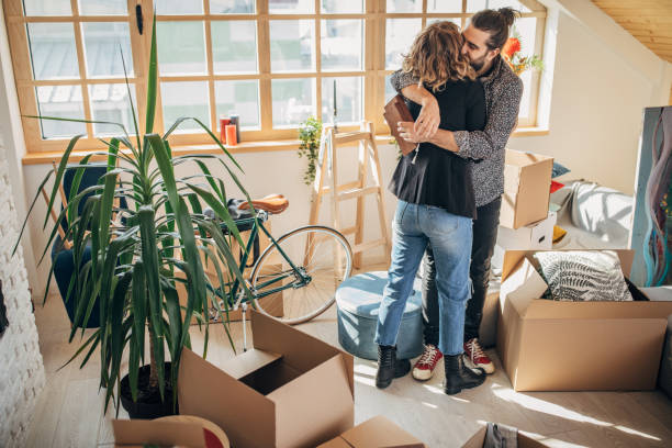 istock Couple hugging in their a new home 1173822551