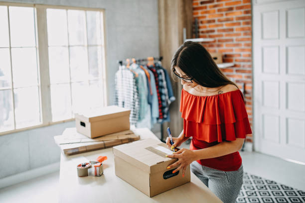 istock Young woman fulfilling online order 1173822704
