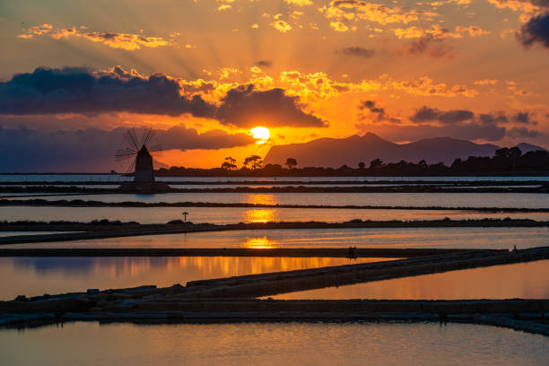 istock Marsala salt pans at sunset, Sicily, Italy 1173824369