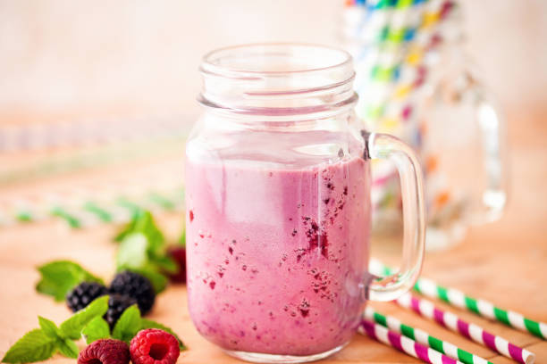 istock Delicious blackberry raspberry smoothie with mint and fresh berries in glasses. Selective focus. 1173827838
