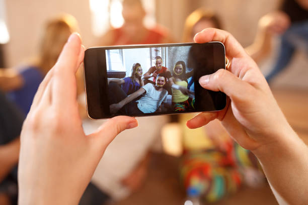 istock Dancers on pause from dancing looking on cell phone 1173828772