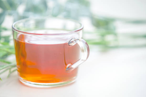 istock Autumn tea. Marigolds and tea cup autumn background 1173830005