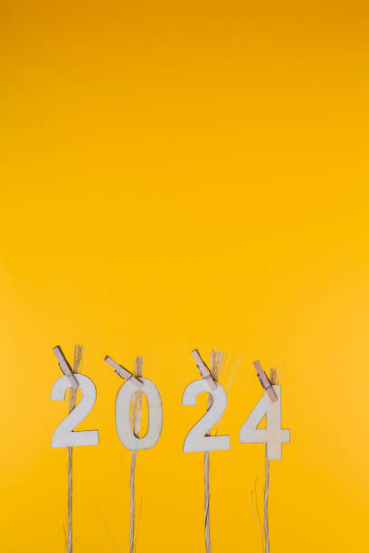 istock New Year 2024 Concepts Clipped Cards on yellow background 1173830341