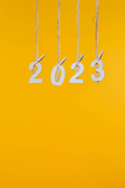 istock New Year 2023 Concepts Clipped Cards on yellow background 1173830706