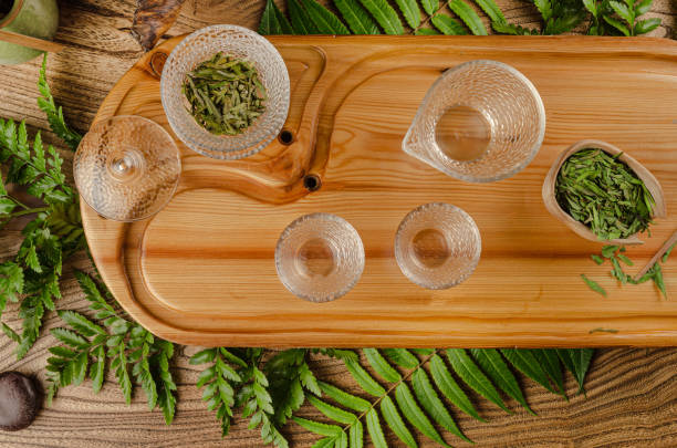 tea table with instruments teapots cups pancake and tea Shen Puer the tea table with instruments teapots cups pancake and tea Shen Puer tao of herbs pictures stock pictures, royalty-free photos & images