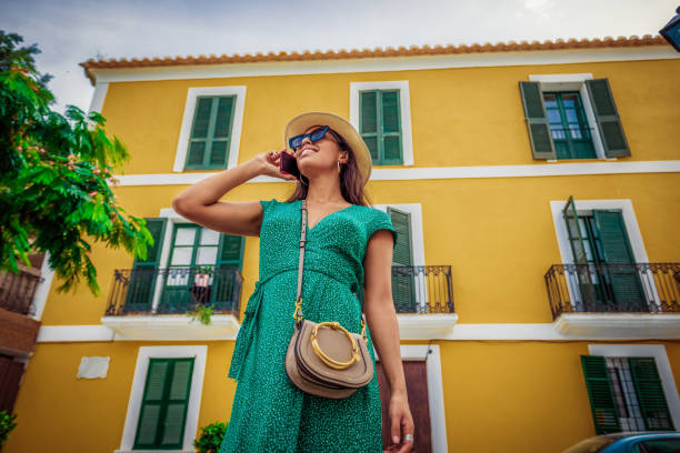 istock beautiful woman talking on her smartphone 1173836078