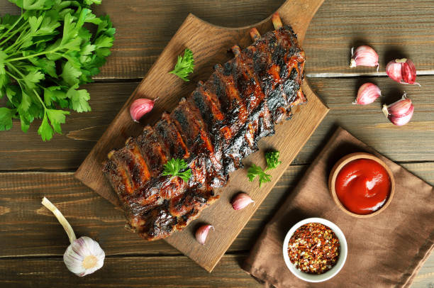 istock Grilled pork ribs on cutting board 1173836438