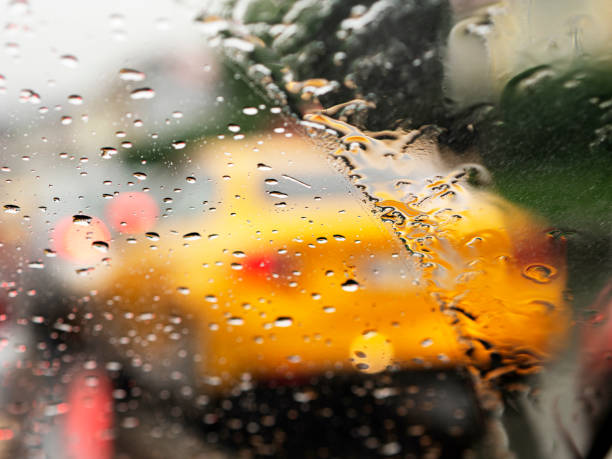 istock Traffic jam on heavy rain day,Car lights seen through wet windshield, Raindrop,Bubble,Condensation on a windowpane, 1173836987