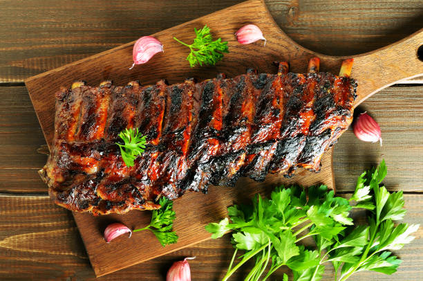 istock Grilled pork ribs on cutting board 1173837137