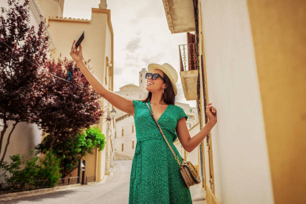 istock beautiful woman taking a selfie 1173837461