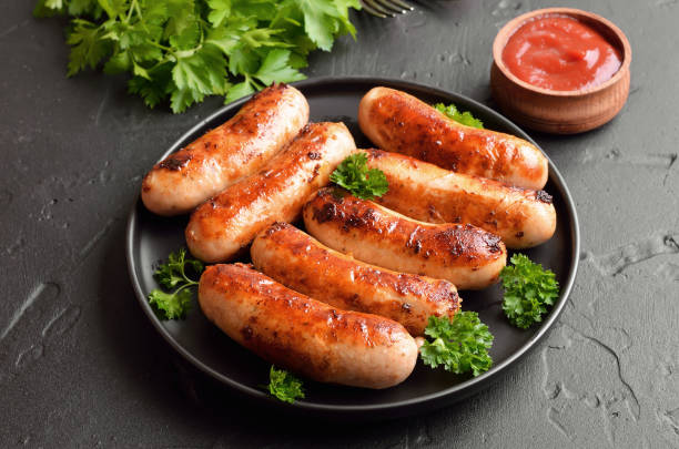 istock Grilled sausage with fresh parsley on plate 1173839580