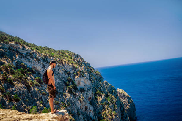 young man standing on the edge