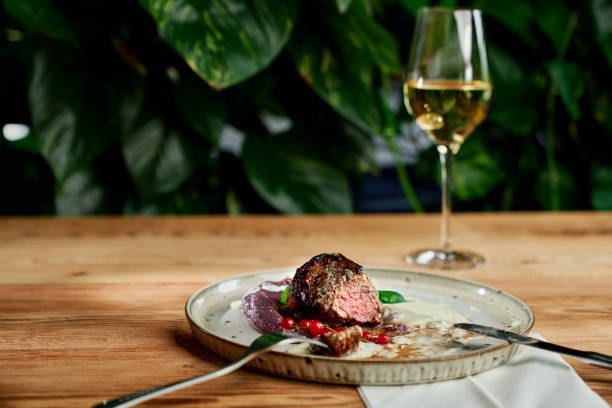 istock Juicy meat served with puree and cranberry 1173843411