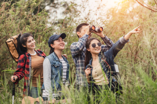 istock Group of backpacking hikers friends going for forest trekking 1173844831