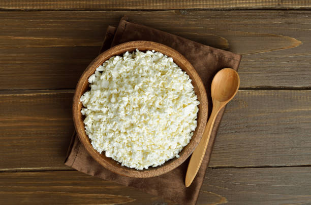 istock Curd cheese in bowl on wooden table 1173845217