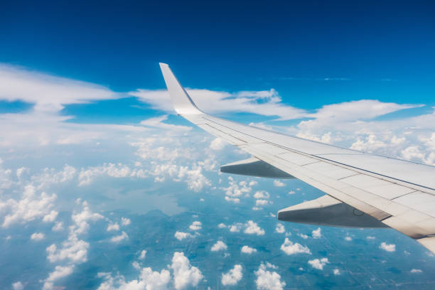 istock Airplane flying above the clouds 1173847912