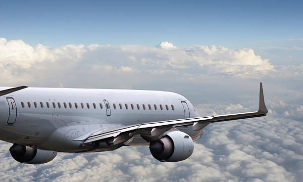 istock Commercial airliner flying over clouds 117384798