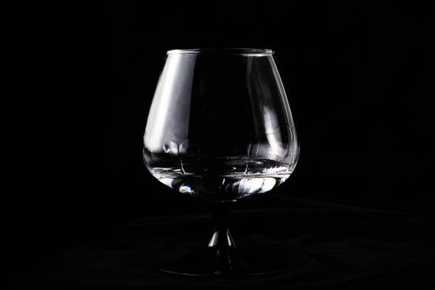 istock Cognac glass with sambuca on a black background 1173852493
