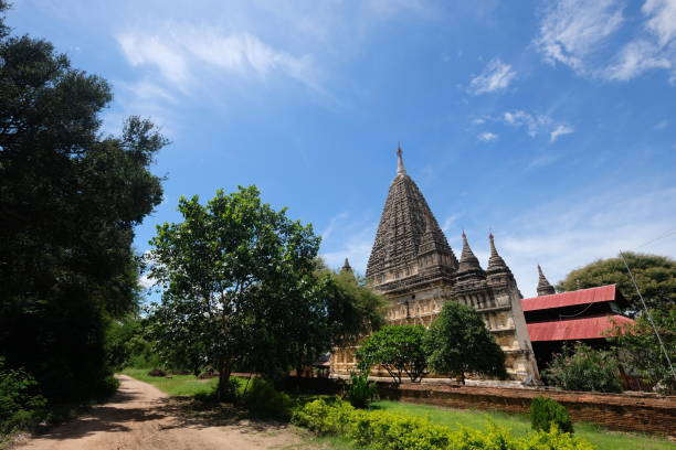 istock Wide angle view of Mahabodhi Temple in Bagan Myanmar under sunny blue sky. Pyramidal ancient buddhist pagoda. 1173853261