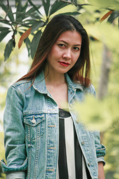 istock woman standing under the leaf 1173853299