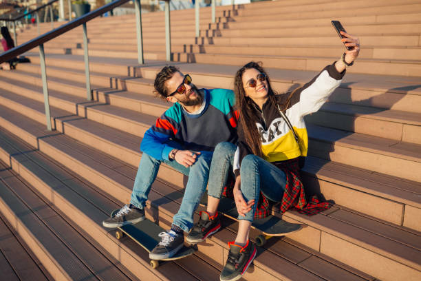 istock Young beautiful couple sitting on the stairs 1173867585