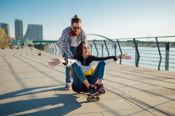 istock Beautiful young couple by the river 1173876343