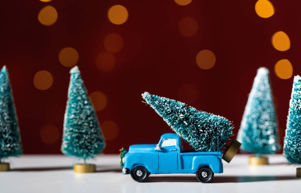 istock Toy truck carrying a Christmas tree 1173881419