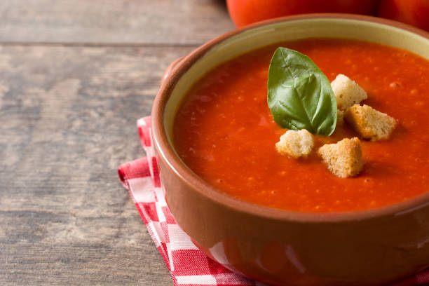 istock Tomato soup in brown bowl 1173882251
