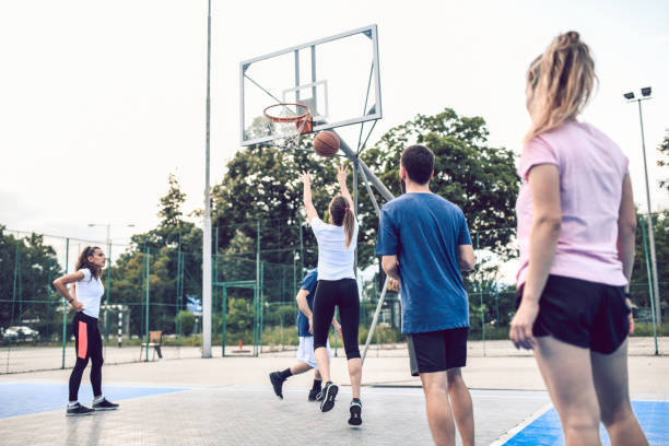 istock Friends Practicing Basketball Outside 1173884682