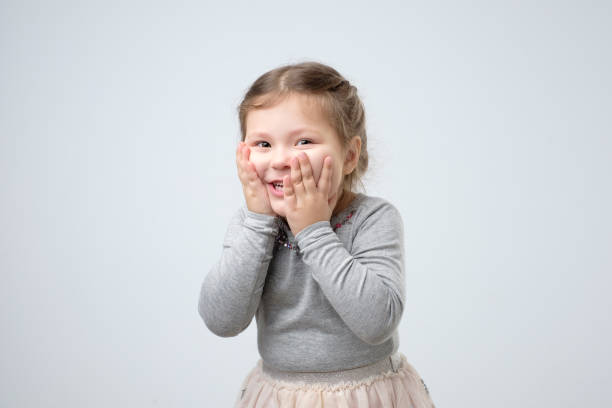 istock Kid getting happy after receiving birthday present from mother. 1173884982