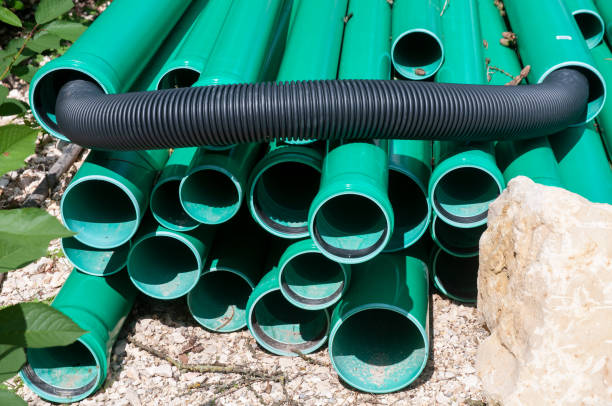 istock heap of green plastic tubes at construction site 1173888383