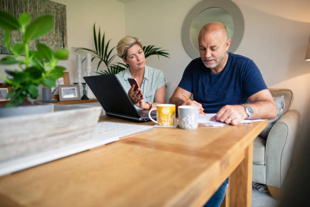 istock Couple Completing Monthly Finances 1173892788