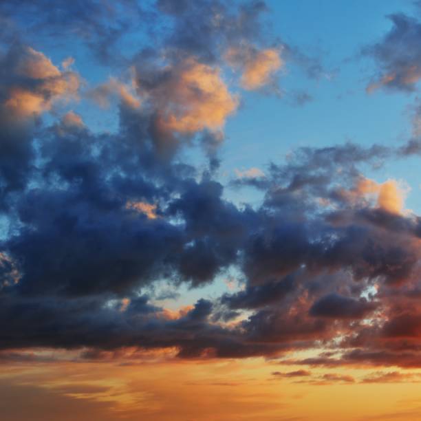 istock Heavy rain clouds over the field at the sunset 1173897273