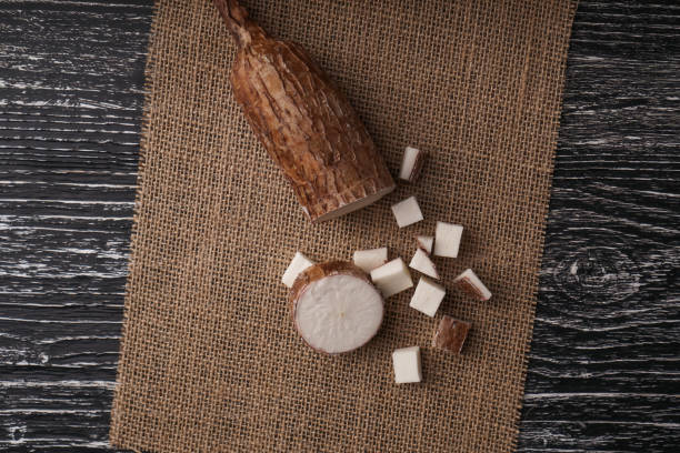 istock Sliced yucca root on a sackcloth on a black wooden table 1173899197