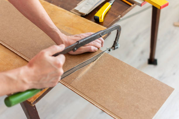 istock Worker cuts a laminate of a certain length 1173901909