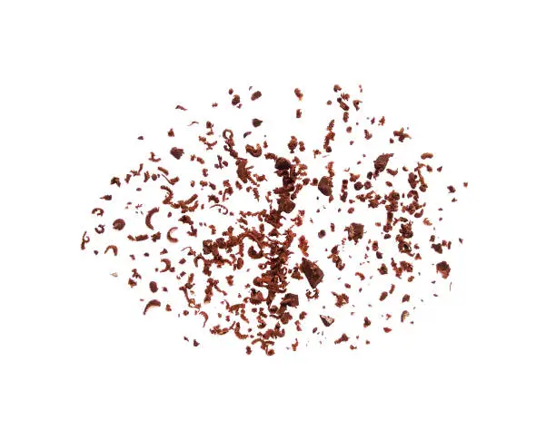 Top view of grated chocolate crumbs isolated on white