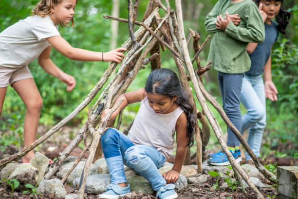 istock Group of children in forest 1173905701